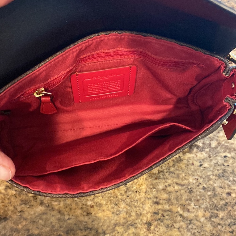 This is a like new coach cross body bag. - Picture 9 of 9